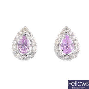 A pair of pink sapphire and diamond cluster earrings.