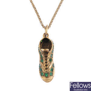 A 9ct gold paste football boot pendant.