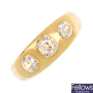 A gentleman's 18ct gold diamond three-stone ring.