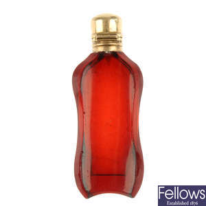 An early 20th century gold topped scent bottle.
