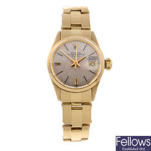 ROLEX - a lady's 18ct yellow gold Oyster Perpetual Date bracelet watch.