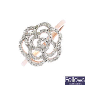 A matching diamond floral ring and pendant.