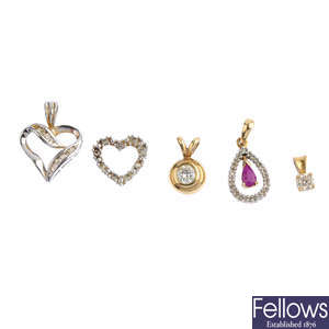 Five diamond and gem-set pendants.