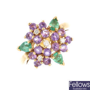 An 18ct gold diamond emerald and amethyst dress ring.