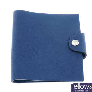 HERMÈS - a blue leather Ulysse notebook cover.