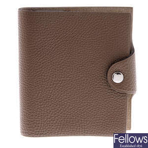 HERMÈS - a taupe leather Ulysse notebook cover and notebook insert.