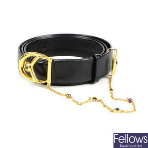 CARTIER - a navy blue leather belt with sapphire cabochons.