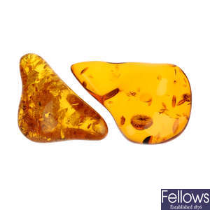 Two pieces of modified amber.
