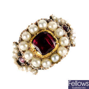 An early 19th century gold garnet and split pearl ring.