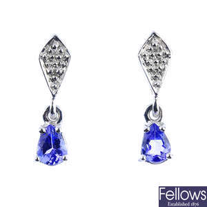 A pair of tanzanite and diamond earrings.