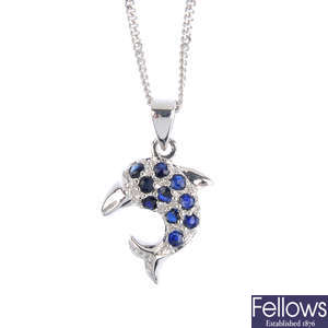 A sapphire and diamond dolphin pendant, with chain.