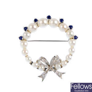 A cultured pearl sapphire and diamond brooch.