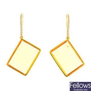 A pair of citrine and diamond earrings.