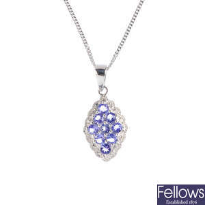 A 9ct gold tanzanite and diamond pendant, with a 9ct gold chain.