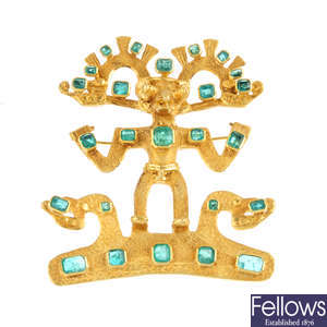 An emerald Pre-Colombian idol brooch.