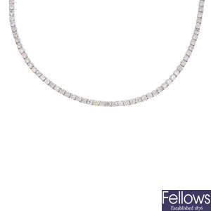 A diamond line necklace.