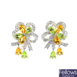 A pair of diamond, peridot and citrine earrings.