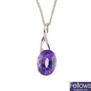 An 18ct amethyst and diamond pendant, with chain.