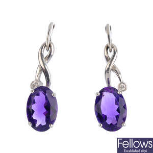 A pair of 18ct amethyst and diamond earrings.