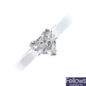 A platinum heart-shape diamond single-stone ring.
