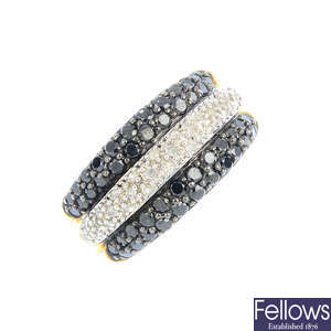 A diamond and black-gem dress ring.