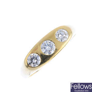 A diamond three-stone ring.
