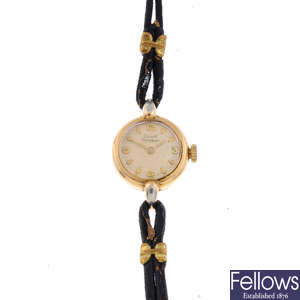 GIRARD-PERREGAUX - a lady's gold plated wrist watch with a 9ct gold wrist watch.