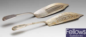A George III silver fish slice & a Victorian example. (2).