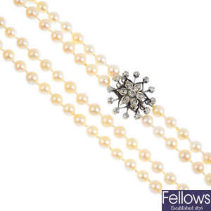 A cultured pearl two-row necklace, with diamond clasp.