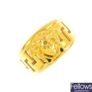 VERSACE - an 18ct gold dress ring.