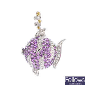 A sapphire and diamond fish pendant.