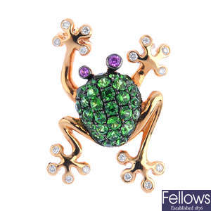 A diamond, tsavorite garnet and sapphire frog pendant.