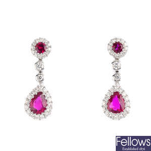 A pair of ruby and diamond earrings.