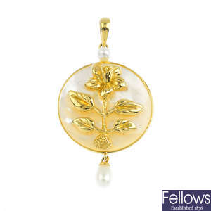 A mother-of-pearl and cultured pearl floral pendant.