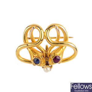 A late Victorian 18ct gold, sapphire, ruby and seed pearl snake brooch.
