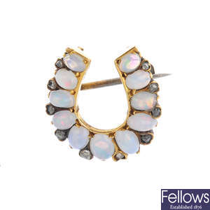 A late Victorian 15ct gold, opal and diamond horseshoe brooch.