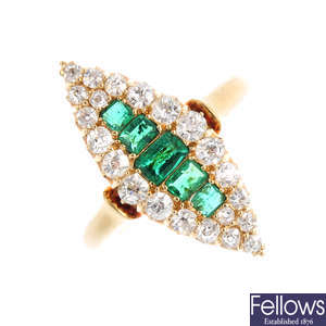 An Edwardian 18ct gold emerald and diamond cluster ring.
