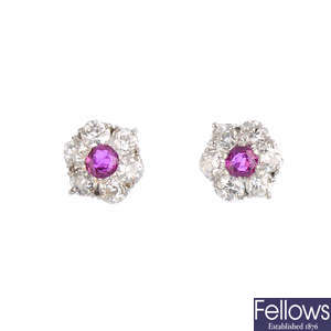A pair of ruby and diamond cluster earrings.
