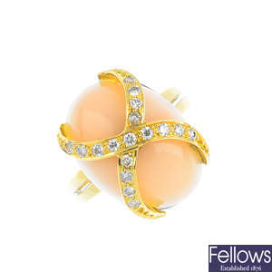 A coral and diamond ring.
