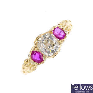 An early 20th century gold, diamond and ruby three-stone ring.