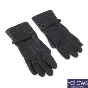 CHANEL - a pair of leather Gauntlet gloves.
