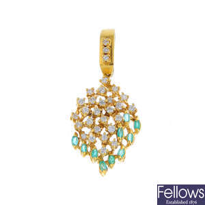 An 18ct gold diamond and emerald pendant.