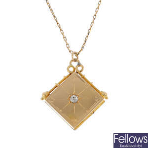 An early 20th century 18ct gold diamond locket, with chain.