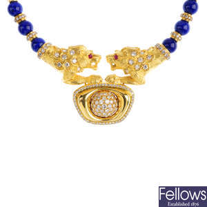 A lapis lazuli and diamond lion necklace.
