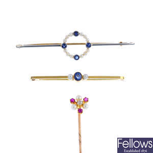 Two early 20th century split pearl and sapphire bar brooches and a gem-set stickpin.