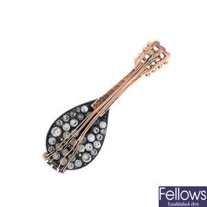An early 20th century gold paste mandolin brooch.