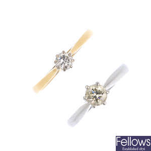 Two platinum and 18ct gold diamond single-stone rings.