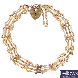 A 9ct gold gate bracelet, with heart locket