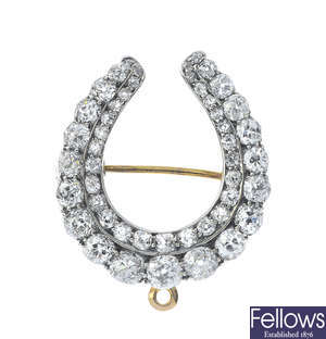 A late Victorian silver and 9ct gold diamond horseshoe brooch.