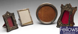 A small selection of items to include four late Victorian and later silver mounted photograph frames, etc.